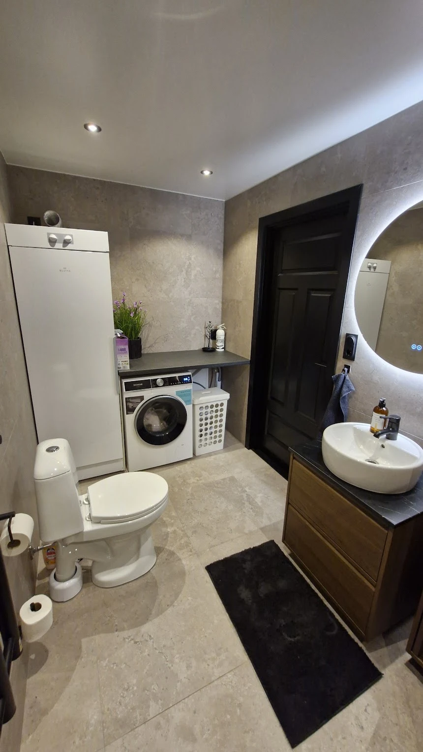 Bathroom with washing machine and drying cabinet