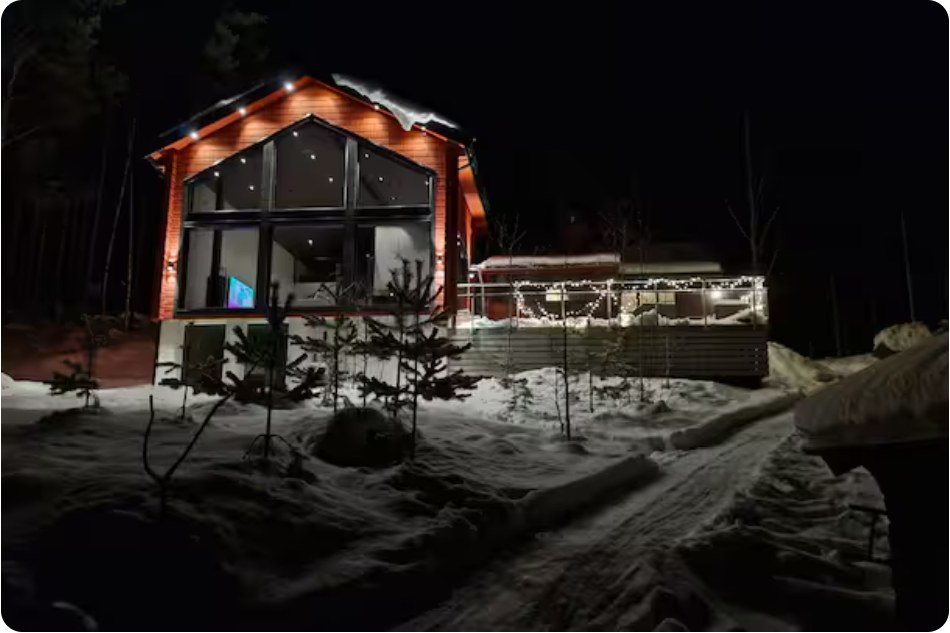 Lake House Dalarna exterior at night
