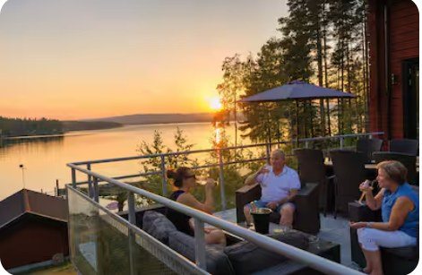 Guests on the terrace at sunset