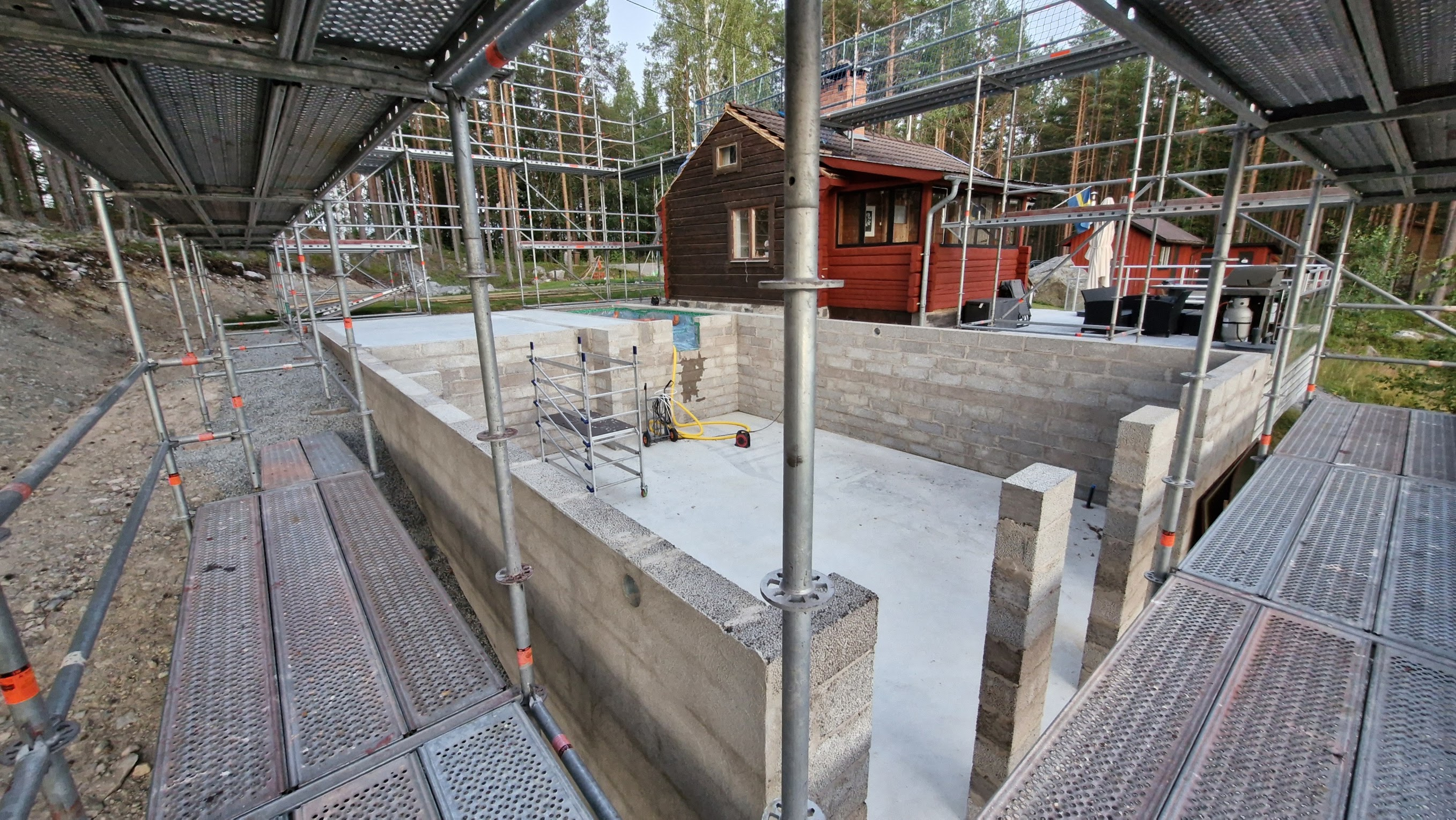 The new lower floor surrounded by scaffolding.