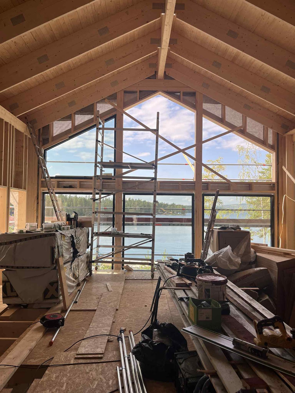 The living room with its new panoramic windows during construction.