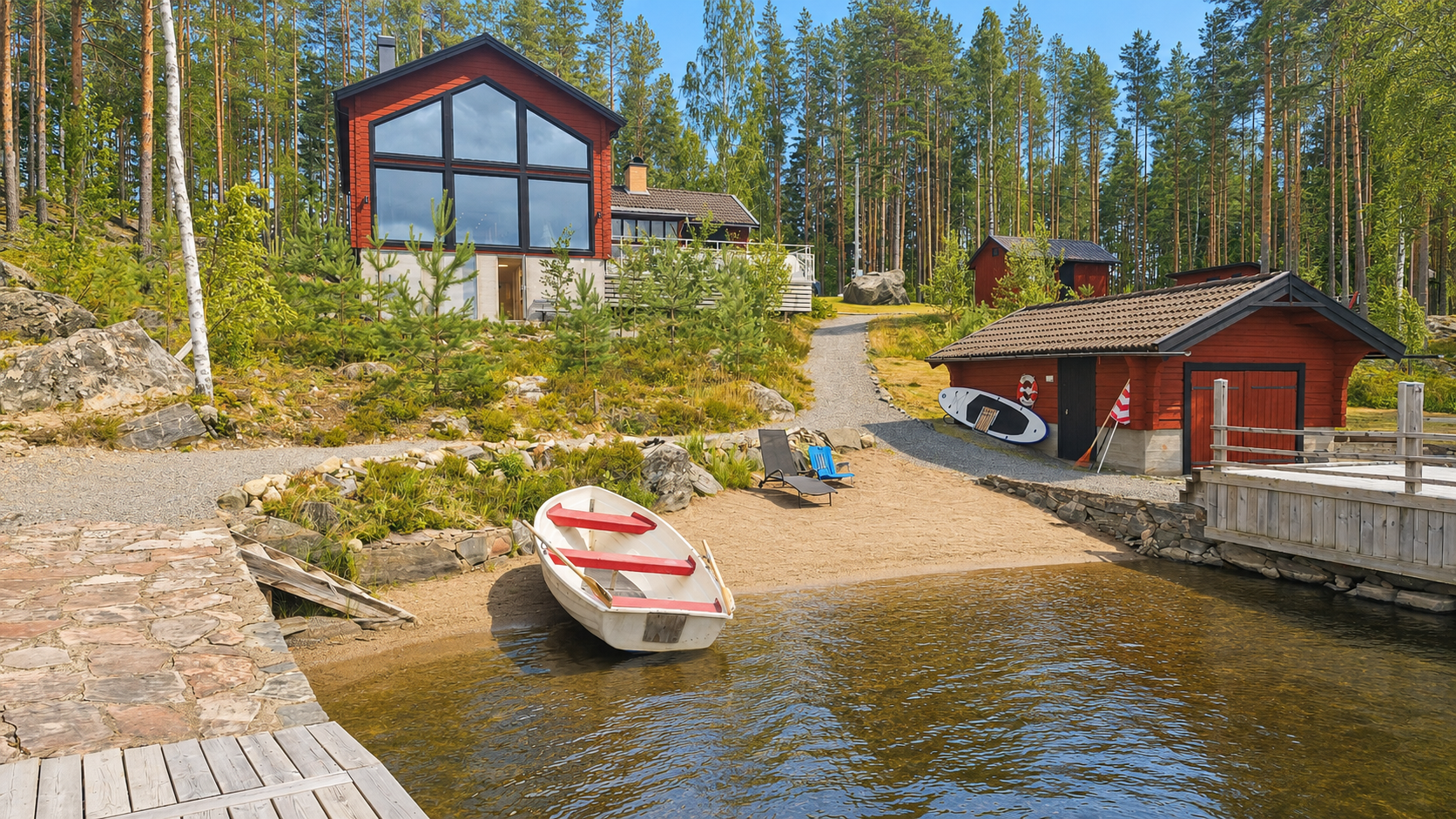 The finished house and beach seen from the lake.