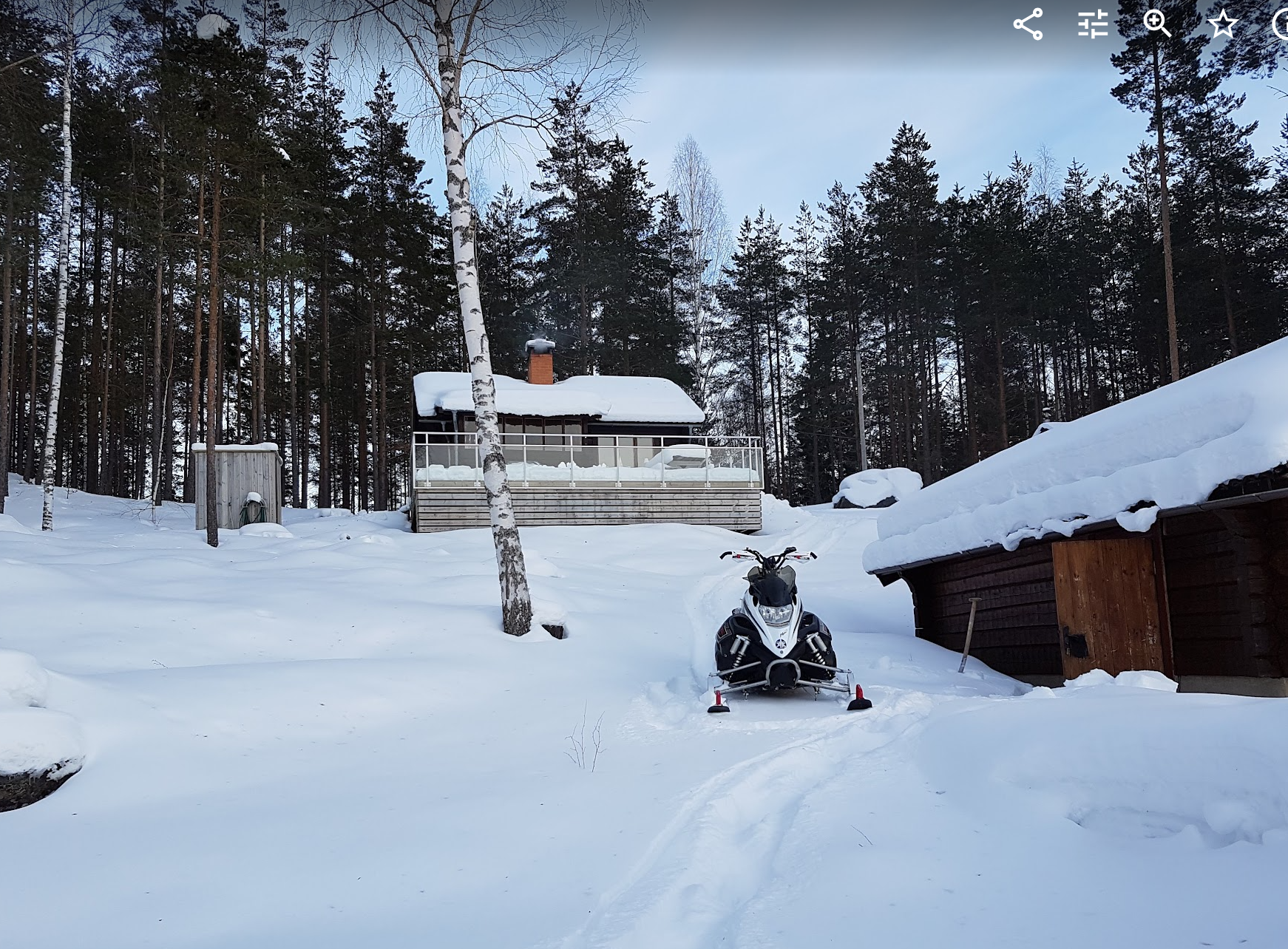 The house and grounds covered in deep snow in winter 2018